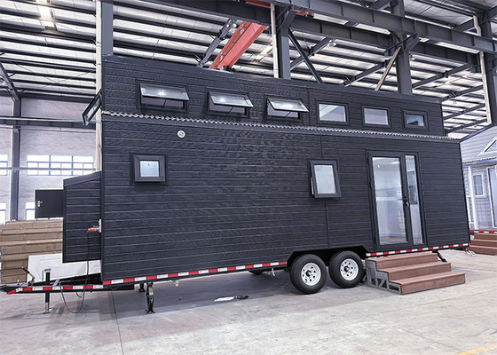 Casa minúscula ligera prefabricada modular de la estructura de acero en cabinas minúsculas de las ruedas en venta